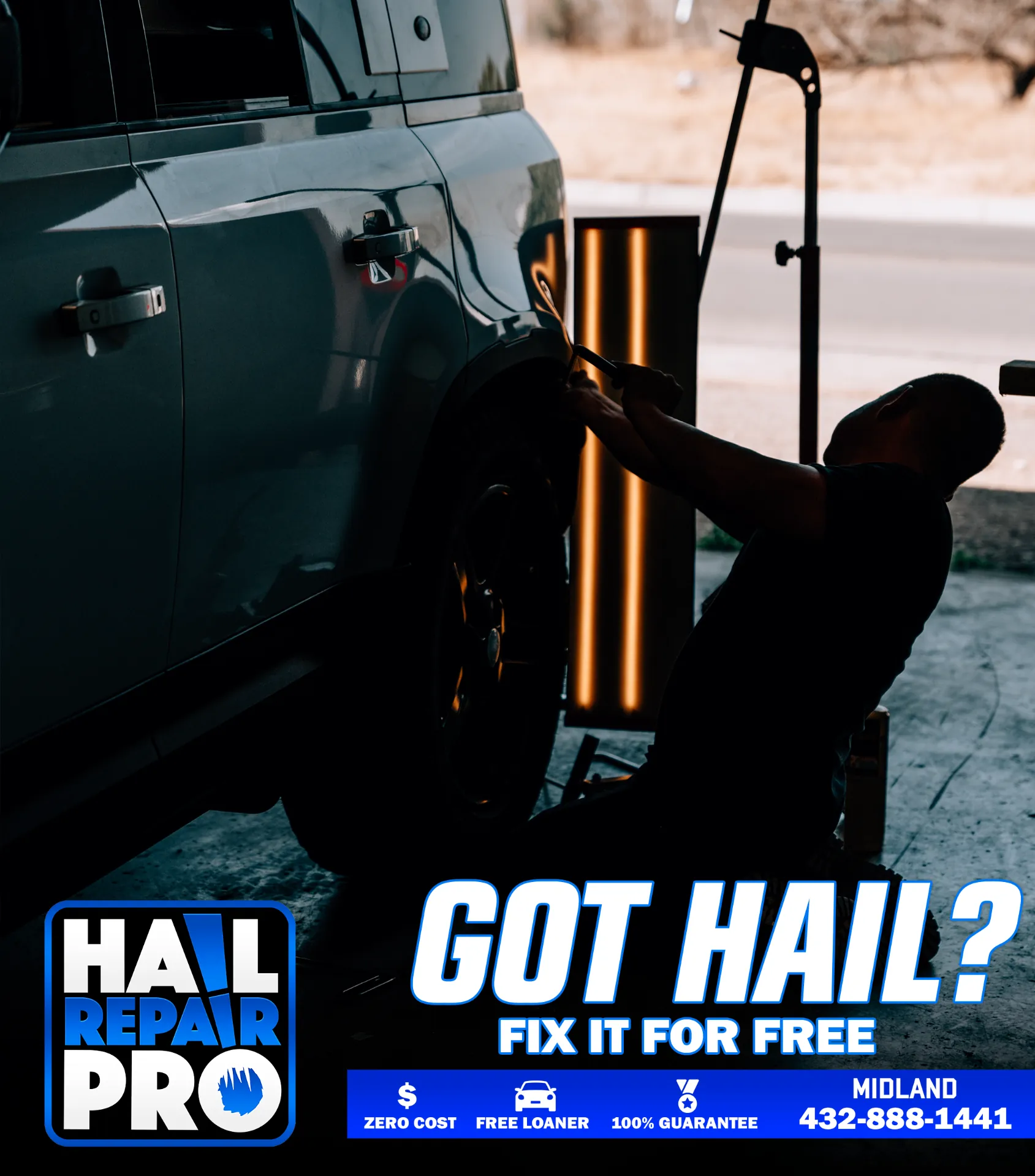 Certified paintless dent repair technician at Hail Repair Pro Midland TX glue-pulling a large dent from a quarter panel under PDR reflection lighting — preserving factory paint and resale value